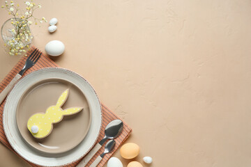 Stylish table setting for Easter celebration with gypsophila flowers on beige background
