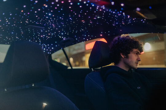 A teenage boy installs Starlights in his car