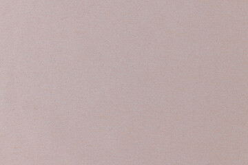 Fototapeta premium Close-up of beige fabric texture background. High resolution photo.