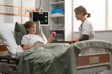 Young patient doing physiotherapy exercises