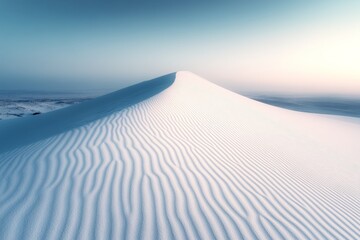 Sand dune photography: White sand dune with textured patterns under a clear sky, creating a minimalist landscape