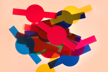 Colorful translucent photo filters on a pink background
