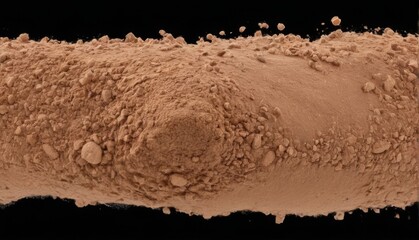 Scattered pile of wrinkled orange dates on black background