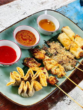 Indonesian food platter on table at restaurant