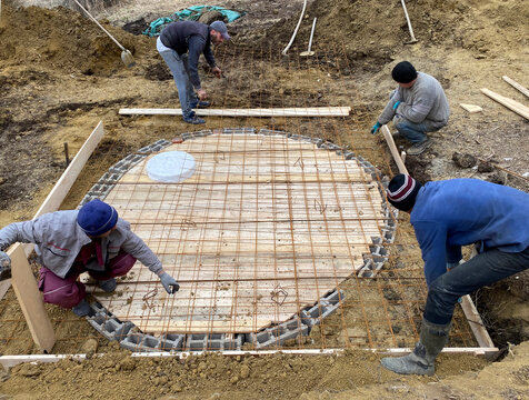 Workers building septic Tank