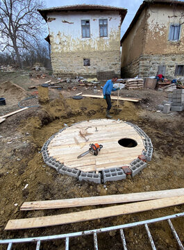 Workers building septic Tank