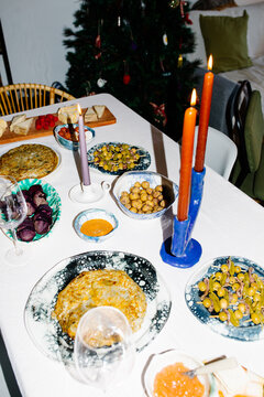 Table set with traditional Spanish tapas for a Christmas gathering