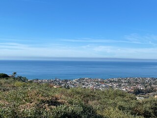 mountain view of the town and ocean 