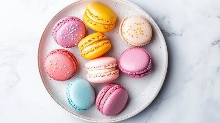 Fototapeta premium A plate of colorful macarons in pastel shades, arranged neatly on a white marble surface.