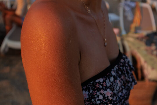 goosebumps on a young woman's shoulder.