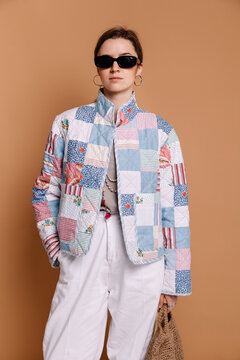 Fashionable woman wearing a colorful quilted jacket