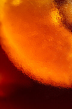 Orange slice in cocktail close-up