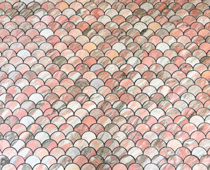 seamless pattern of fish scale mosaic tiles pink marble colour © Angela
