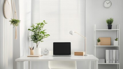 Fototapeta premium A bright home office with simple white furniture. A laptop sits on a desk, next to a bookshelf and a plant stand with a clock. 