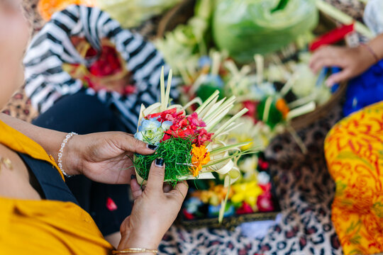 Balinese women preparing Canang sari, a daily offering 
