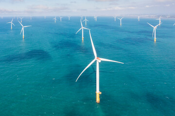Offshore Wind Farm Aerial View Over Turquoise Ocean Waters