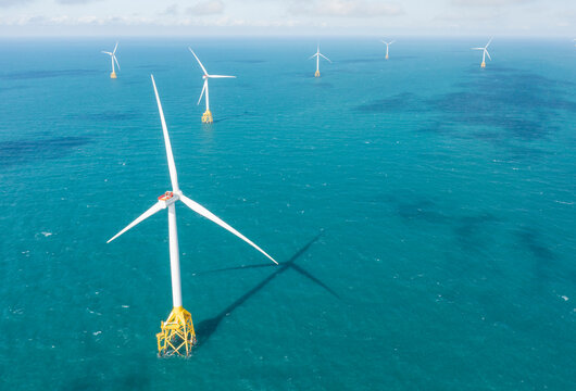 Offshore Wind Farm Aerial View Over Turquoise Ocean Waters
