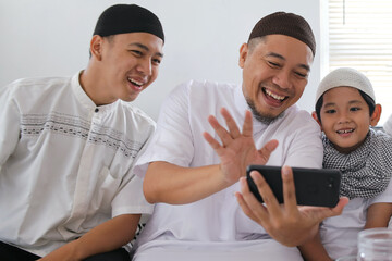 Muslim People Talking On Video Call With Family Members To Forgive Each Other During Eid Celebration