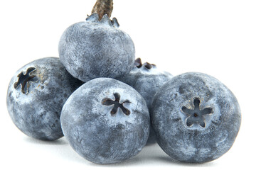 A vibrant macro shot captures the exquisite detail of a cluster of fresh blueberries.