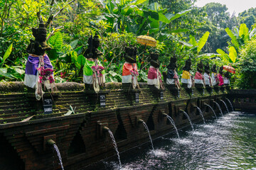 Traditional balinese statues pouring water in Bali