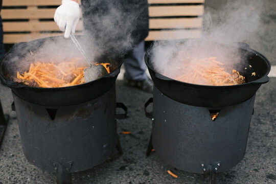 cooking pilaf in two cauldrons