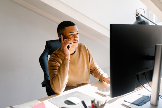 Black man conducting job interviews over the phone
