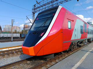 Modern high-speed train arrives at the railway platform