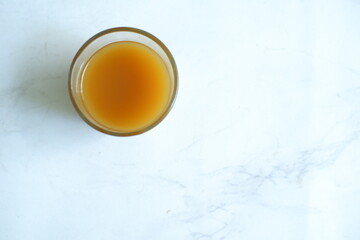 A glass of healthy drink or jamu tradisional in white background 