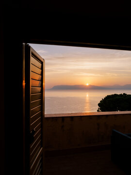 Sunrise through a window in Sicily