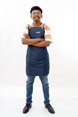 Full body young asian man barista barman employee wear blue apron work in coffee shop hold hand...