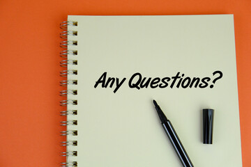Notepad with text Any Question. on yellow background
