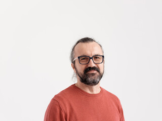 Portrait of Bearded Man In His 50s Wearing Glasses and a Red Sweater 