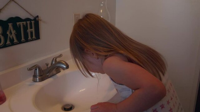 Little Girl Brushing Her Teeth