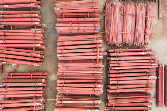 Red Metal Scaffolding Poles Storage Construction Site Equipment