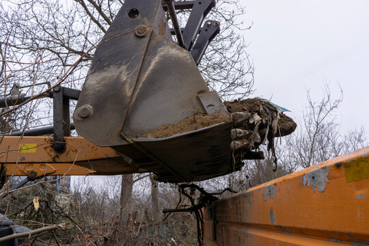A backhoe loader moves earth