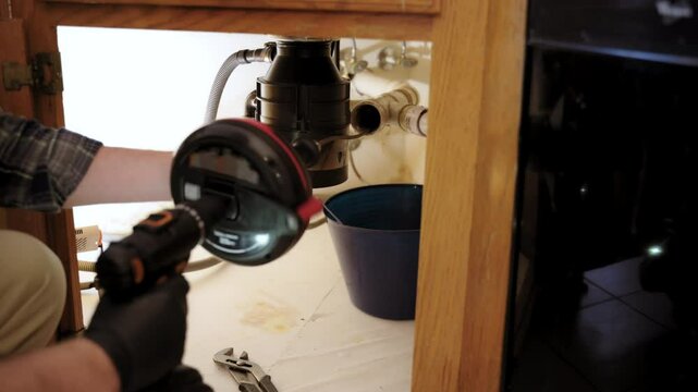 Close up view of Cleaning, repairing, and inspecting drainage systems to clogs. Kitchen sewer pipe maintenance: