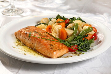 Grilled salmon with vegetables on plate