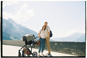 Family with Stroller and Mountain Backdrop
