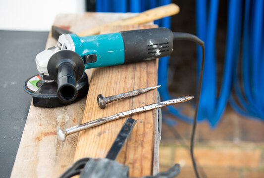 Angle grinder on a work bench