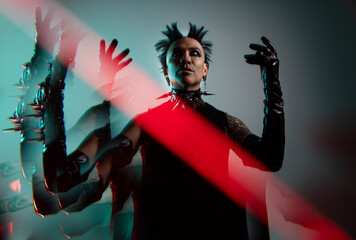 Dramatic portrait of man in eccentric punk fashion