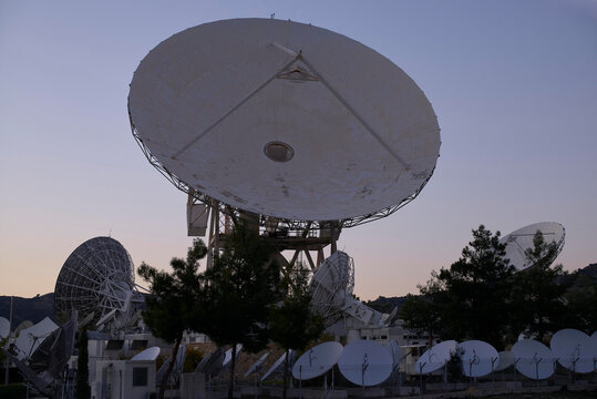 Satellite dishes in Cyprus earth link statio during offseason twilight