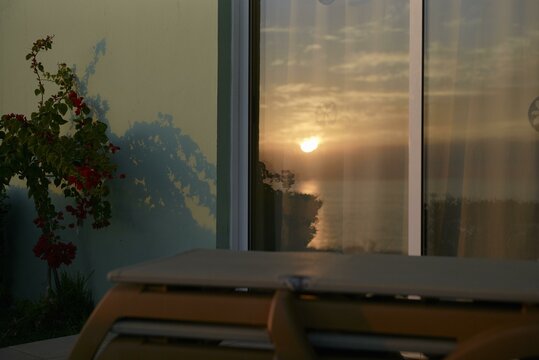 Beautiful sunset view over the coast of Cyprus reflecting in a window