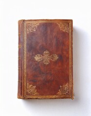 Fototapeta premium Antique leather-bound book with intricate gold detailing. Rich brown tones and aged texture create a sense of history and elegance.