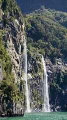 Milford Sound New Zealand dual waterfalls into the fjord