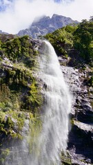 Fototapeta premium Milford Sound New Zealand waterfalls into the fjord