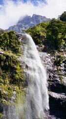 Milford Sound New Zealand waterfalls into the fjord