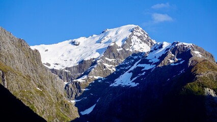 Milford Sound New Zealand snow capped mountains and valleys