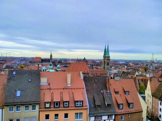 Fototapeta premium Aerial view of Nuremberg at Sunset with St. Sebaldus Church Tower (Sebalduskirche) - Nuremberg, Bavaria, Germany
