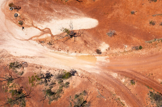 Miners shacks in a red outback landscape