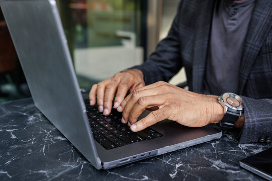Blogger typing on laptop